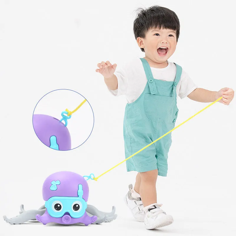 Children Playing In Water Walking Octopus Toy